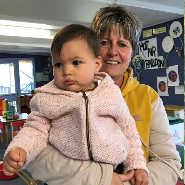 Peta, home-based educator in Rotorua, with children